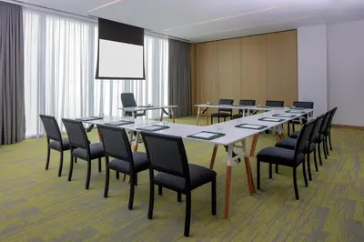 a conference room with a long table and chairs at Staybridge Suites Dubai Business Bay by IHG in Dubai