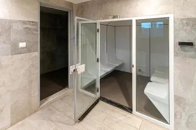 a walk in shower with glass doors in a bathroom at Contemporary furnishing I City skyline view in Dubai