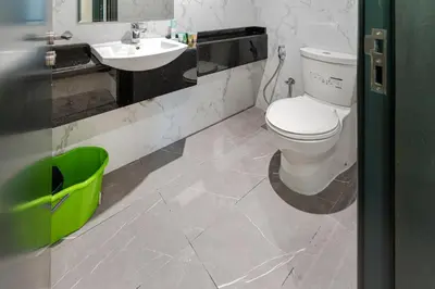 a bathroom with a toilet and a sink at Contemporary furnishing I City skyline view in Dubai