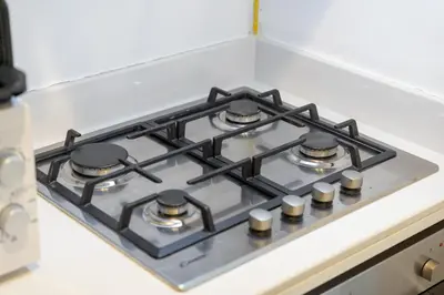 a stove top oven sitting on top of a kitchen counter at Business Bay Bliss 1 bedroom apartment - Suiteable in Dubai