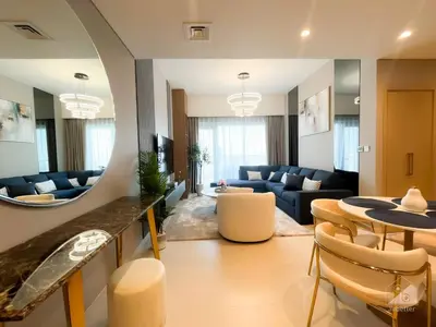 a living room with a couch and a table at NEW! Modern Elegance 2B in Burj Royale Downtown in Dubai