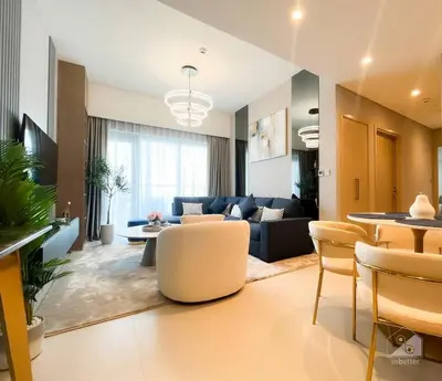 a living room with a couch and a table at NEW! Modern Elegance 2B in Burj Royale Downtown in Dubai