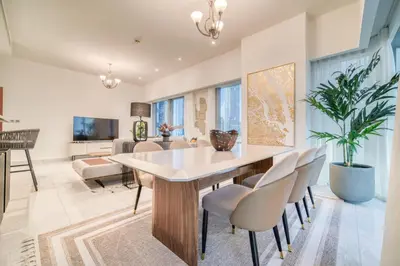 a dining room with a table and chairs at Central Park Towers, City View - DIFC - Mint Stay in Dubai