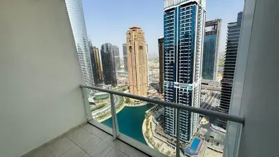 a view of a city from a balcony in a building at Jumeriah Lake Tower (JLT)-(LAKE VIEW) in Dubai