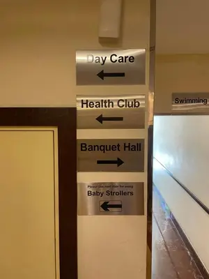a sign for the day care health club and barrowvelt hall baby survivors at Marina view with Pool, Gym, Tennis Court, 5 mins to Beach in Dubai