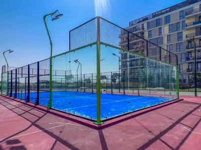 a basketball court in a building with a glass enclosure at Midtown Haven Cozy One Bed in Dubai in Dubai