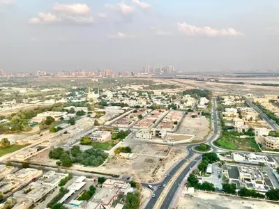an aerial view of a city with buildings and roads at Luxurious 1-bedroom With Skyline View In Downtown Views Ii in Dubai