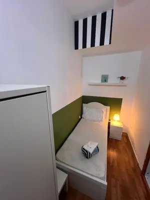 a small bedroom with a bed in a room at Bachelor Partition Room in Tecom Near Internet City Metro in Dubai