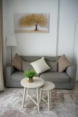 a living room with a couch and a table at Elite Studio at Dubai Marina in Dubai