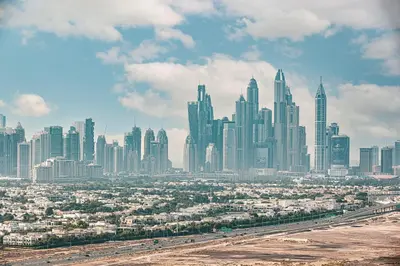 a cityscape of a large city with a highway in the foreground at Cozy Studio 29th Floor, Bloom Towers Marina View in Dubai