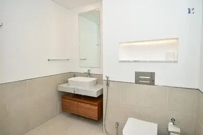 a bathroom with a sink and a mirror at Luxury Escapes - Contemporary 2BR Gem in Madinat Jumeirah - RAHAAL in Dubai