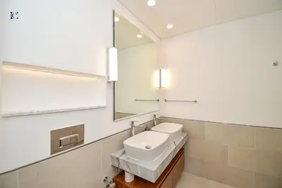 a bathroom with a sink and a mirror at Luxury Escapes - Contemporary 2BR Gem in Madinat Jumeirah - RAHAAL in Dubai