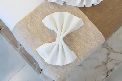 a piece of white cloth sitting on top of a table at Nice Studio in heart of JVC - Pantheon Elysée - Dubai in Dubai