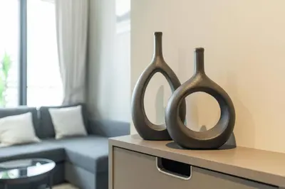 two mirrors sitting on a table in a living room at 1 Bedroom in Zada Tower - Business Bay - Dubai in Dubai