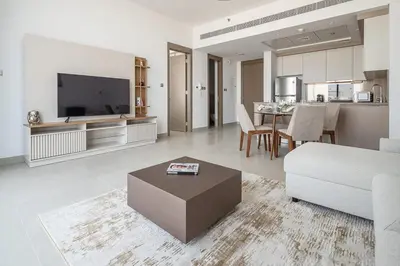 a living room with a couch and a table at Frank Porter - Bluebell Residence in Dubai
