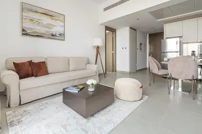 a living room with a couch and a table at Frank Porter - Bluebell Residence JVC in Dubai