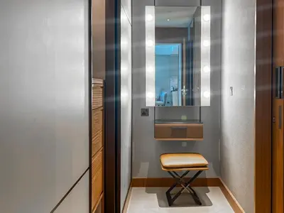a small bathroom with a chair and a mirror at #37 Luxury - 2BR in The Address Dubai Opera - Downtown in Dubai