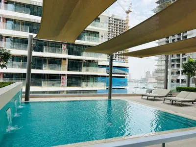 a swimming pool in the middle of a building at StoneTree - Luxurious with Private Beach Access in Dubai