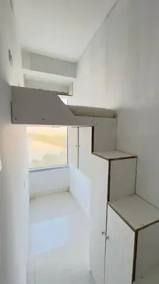 a room with white walls and a window at Amiqa Homes DIP 1 in Sharjah