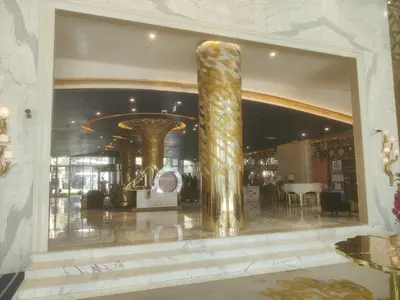 a lobby with a large window with a large column at LeModCasa - Luxury smart Studio with Canal View Business Bay in Dubai