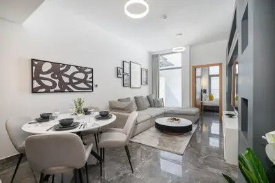 a living room with a couch and a table and chairs at Modern Comfort in a Spacious Apartment - Suiteable in Dubai