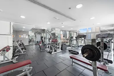 a gym with treadmills and machines in a building at Tranquil Dubai Marina Studio by JBR Beach, Marina Mall, Metro in Dubai