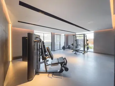 a gym with several tread machines in a room at New Listing - TOP Amenities in JVC in Dubai