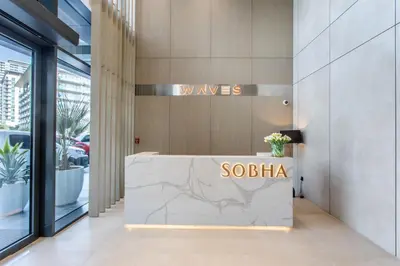 a lobby of a building with a sign that reads soba at STAY BY LATINEM Luxury 2BR Holiday Home W1504 near Burj Khalifa in Dubai