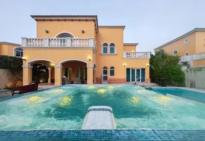 a large swimming pool in front of a house at Royal private pool, Lux 7-bedroom villa on Marina in Dubai