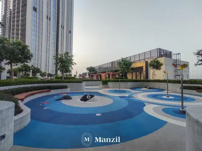 a courtyard in the middle of a city at Manzil - Luxury 4BR Penthouse with Harbour View & Private Terrace at Dubai Creek Harbour in Dubai
