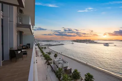 a view of the ocean from a balcony of a building at YOUR STAY APARTMENTS Luxury Beachfront Living in Dubai