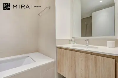 a bathroom with a sink and a bath tub at Mira Holiday Homes - Fully furnished 2 bedroom in Dubai Hills in Dubai