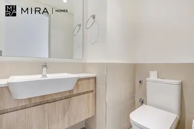 a bathroom with a white sink and a toilet at Mira Holiday Homes - Fully furnished 2 bedroom in Dubai Hills in Dubai
