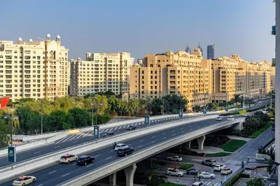 an overhead view of a highway in a city with buildings at Apartment in Fairmont South Residence Palm Jumeirah in Dubai