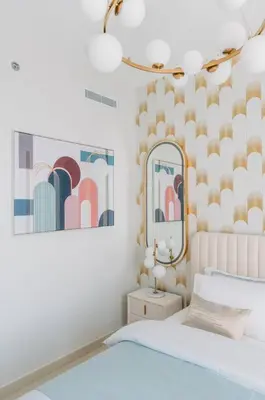 a bedroom with a bed and a mirror at Luxury Dubai Creek Balcony & View in Dubai