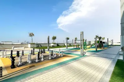 a playground on the roof of a building at Sleek One Bed Sobha Creek Vistas Reserve Tower A in Dubai