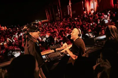 two people standing in front of a large audience at FIVE LUXE in Dubai