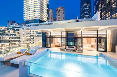 a swimming pool on the roof of a building at FIVE LUXE in Dubai