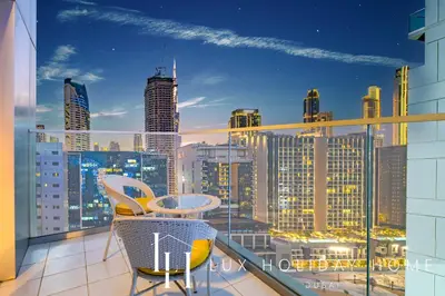 a balcony with a view of a city skyline at The Majestine Studio in Dubai