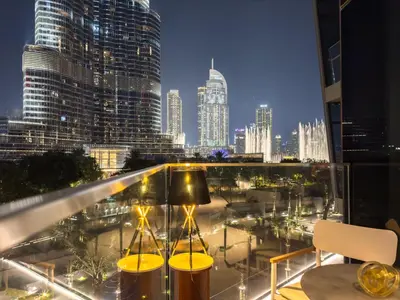 a balcony with a view of a city skyline at The Address Residences Dubai Opera, Full Burj Khalifa View, Luxurious 2BR in Dubai