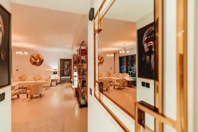 two views of a living room and a dining room at Vida Dubai Marina & Yacht Club, Hotel and Residences, Luxurious 2BR in Dubai