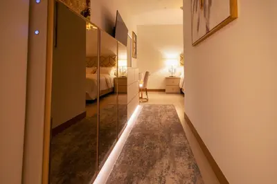 a hallway with a glass door leading to a bedroom at Vida Dubai Marina & Yacht Club, Hotel and Residences, Luxurious 2BR in Dubai