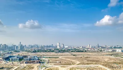 an aerial view of a city with tall buildings at Appealing Studio at Carson C DAMAC Hills Dubailand by Deluxe Holiday Homes in Dubai
