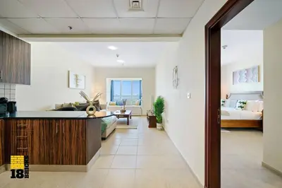 a large room with a bed and a living room at Lux Sea view 1BR in Dubai Marina in Dubai