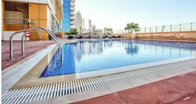 a swimming pool in the middle of a building at Lux Sea view 1BR in Dubai Marina in Dubai