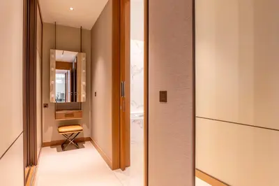 a hallway with a door leading to a bathroom at Address Dubai Opera Residences in Dubai