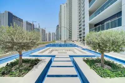 a view of a building with trees and buildings at Burj View Apartment at Vera, Business Bay in Dubai