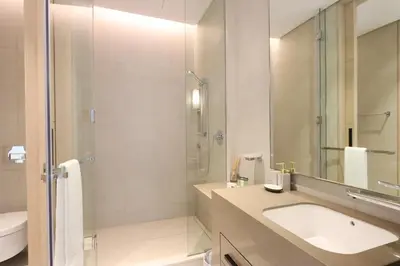 a bathroom with a sink and a shower at Livbnb Premium 3BR at Address JBR Posh Interiors with Sea and Ain Views in Dubai