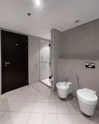 a bathroom with a toilet and a bidet at Authentic 2 bdr in Anantara Resort Palm Jumeirah in Dubai