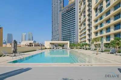 a swimming pool in the middle of a building at Stylish 2BR with Burj Khalifa View at Burj Royale Downtown Dubai by Deluxe Holiday Homes in Dubai